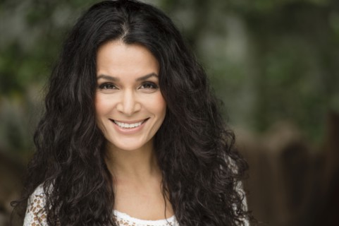 Hispanic woman smiling outdoors