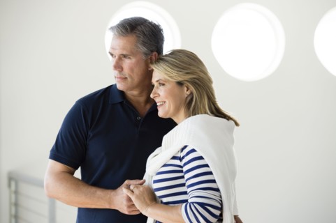 Caucasian couple holding hands