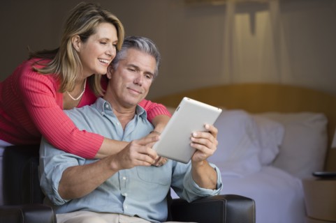 Caucasian couple using tablet computer