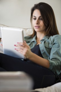 Caucasian woman using tablet computer
