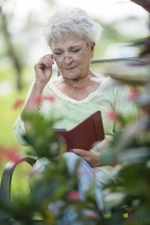 Senior Caucasian woman using digital tablet outdoors