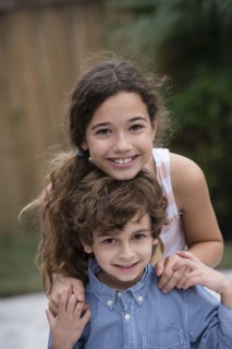 Mixed race children smiling together