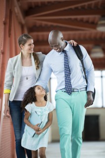 Family walking together on walkway
