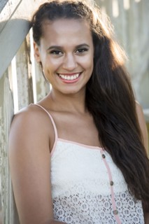 Mixed race woman sitting on wooden steps
