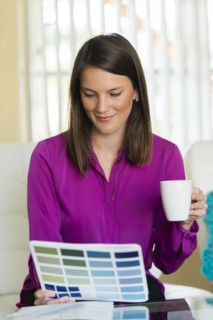 Caucasian businesswoman examining color swatches