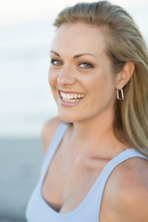 Caucasian woman smiling on beach