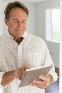 Caucasian man using digital tablet