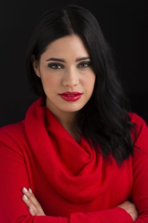 Glamorous Hispanic woman with arms crossed