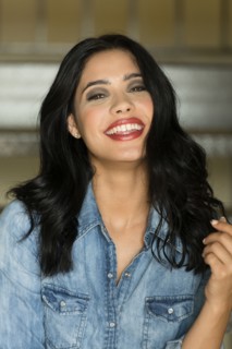 Glamorous Hispanic woman wearing lipstick