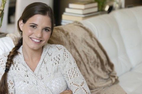 Caucasian woman sitting on sofa