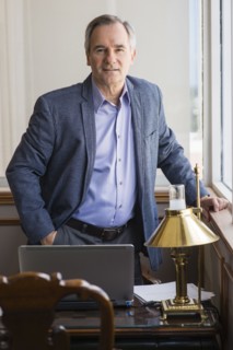 Caucasian businessman standing at office desk