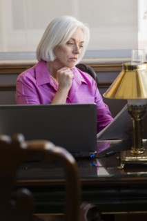 Caucasian businesswoman working at office desk