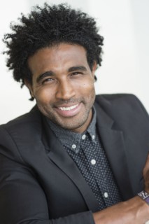 Close up of smiling Hispanic businessman