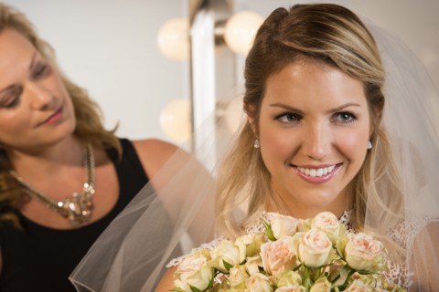 Close up of bride and maid of honor smiling