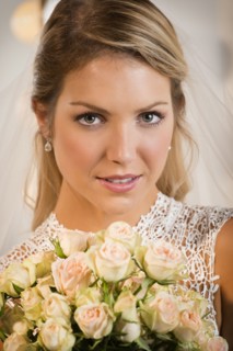 Close up of bride holding bouquet of flowers