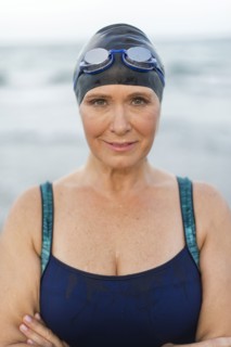 Caucasian swimmer on beach