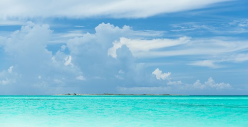 Tropical ocean under blue sky