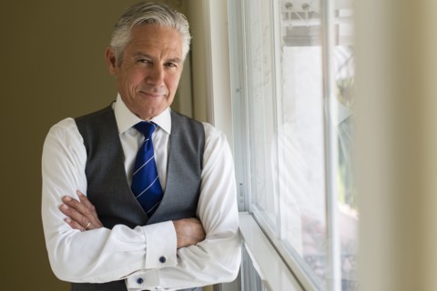 Caucasian businessman standing at window