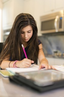 Mixed race girl doing homework