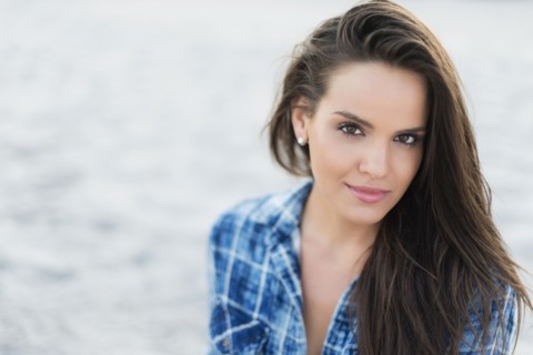 Hispanic woman smiling outdoors