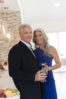 Caucasian couple drinking wine in kitchen