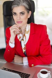 Caucasian businesswoman using laptop in office
