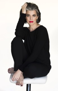 Caucasian woman sitting on stool