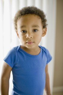 Serious mixed race young boy