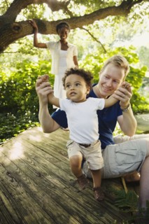 Multi-ethnic family enjoying garden
