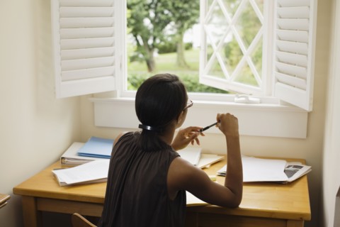 African woman sitting at desk