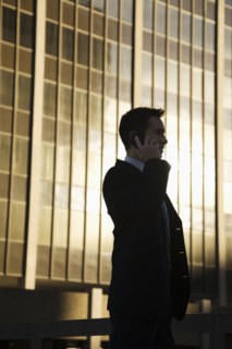 Mixed race businessman talking on cell phone