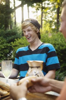 Friends hanging out together eating outdoors