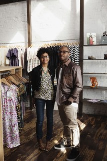 Couple standing together in clothing store