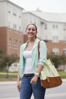 Caucasian student walking on campus