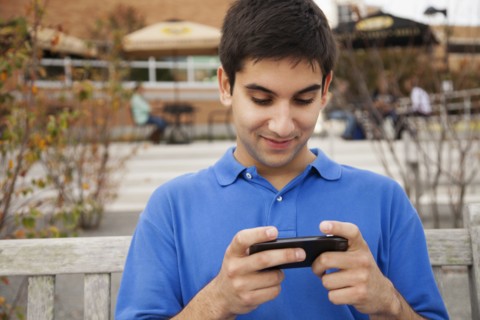 Middle Eastern student using cell phone