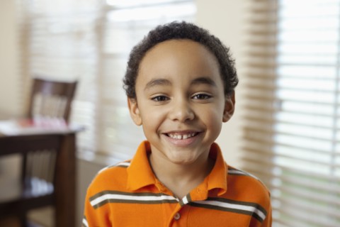 Mixed race boy smiling