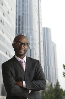 Black businessman smiling on city street
