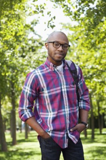 Black man smiling in park