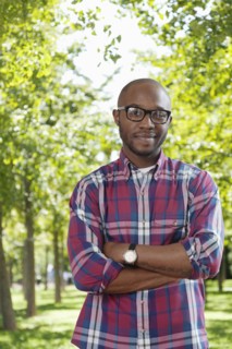 Black man smiling in park