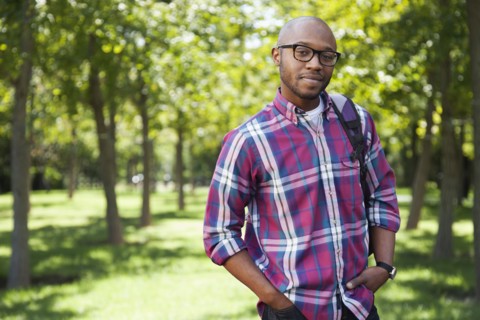 Black man smiling in park