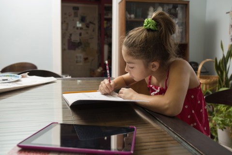 Mixed race girl doing homework