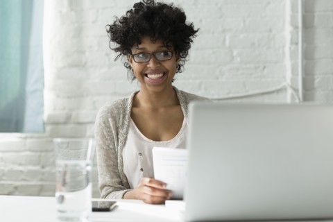 Mixed race architect working at desk