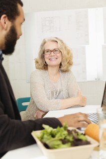 Business people having lunch together in office