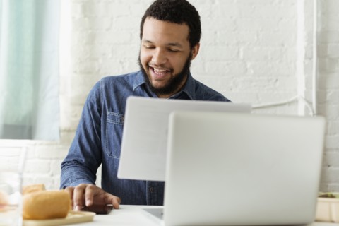 Mixed race businessman working at desk