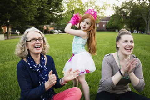 Three generations of Caucasian women relaxing in park