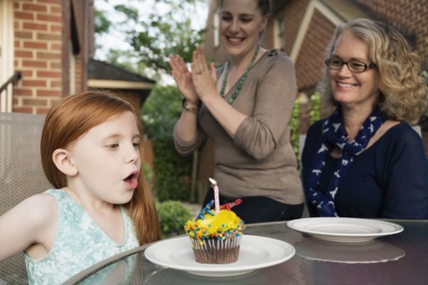 Three generations of Caucasian women celebrating birthday