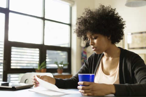 Mixed race businesswoman working in office