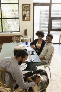Friends relaxing together at table