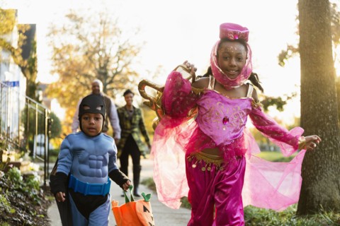 African American children trick-or-treating on Halloween