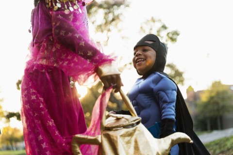 African American children trick-or-treating on Halloween
